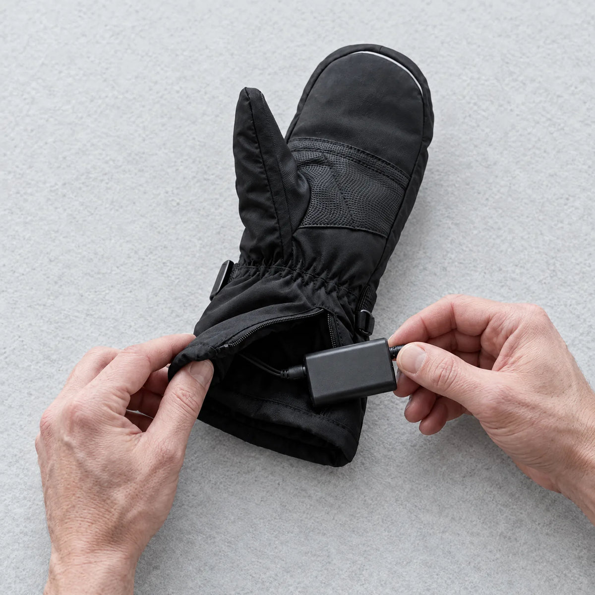 Battery being connected to the heated mitten