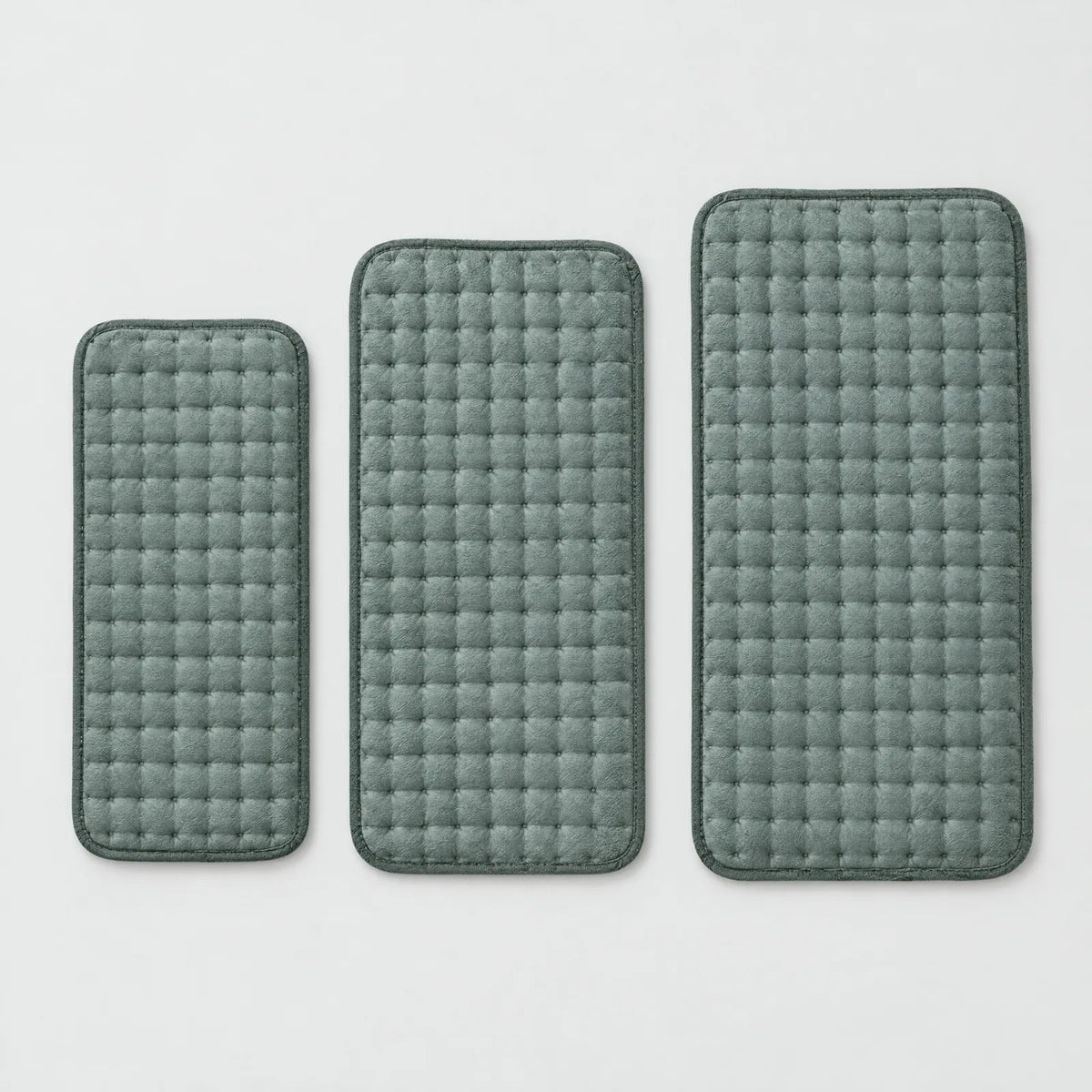 The three sizes of the heating pad side by side